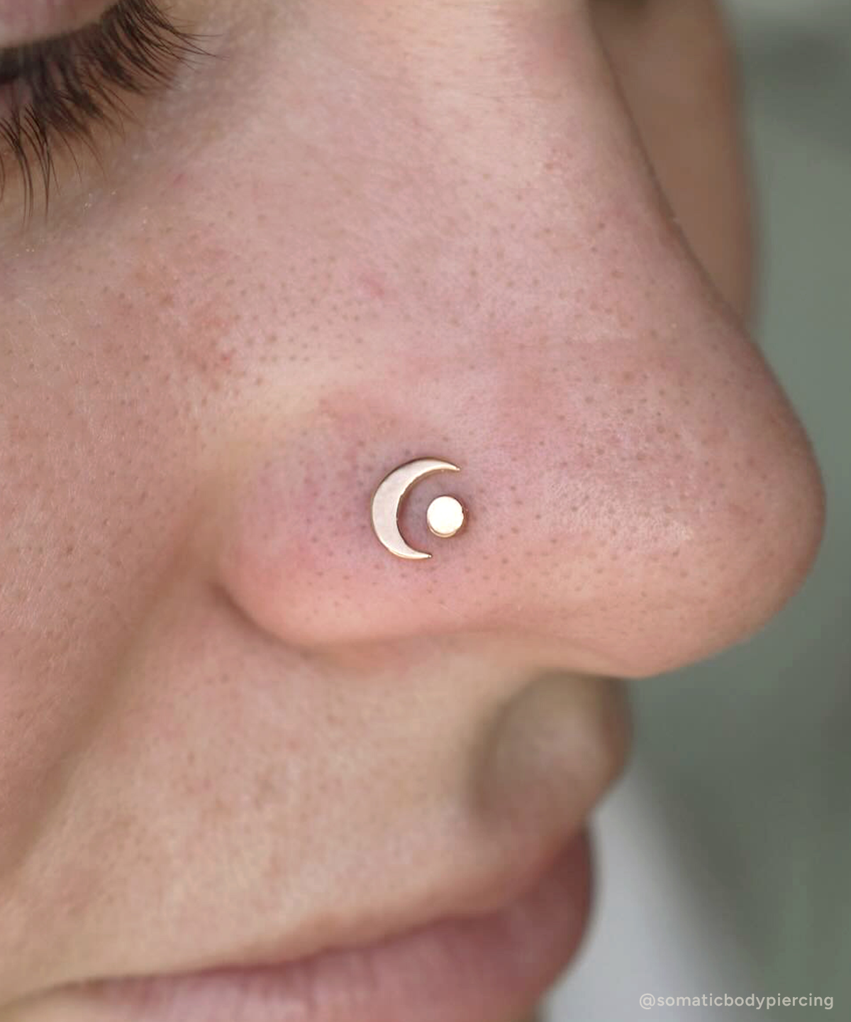 Moon and Disk end in double nostril piercing